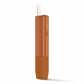 Copper IQOS Iluma One device with inserted tobacco stick on a white background.
