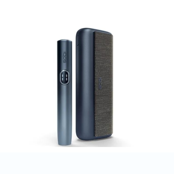 Navy IQOS ILUMA i PRIME holder standing beside dark fabric‑textured case.

