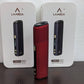 Red LAMBDA CC device standing before two product boxes with black devices.