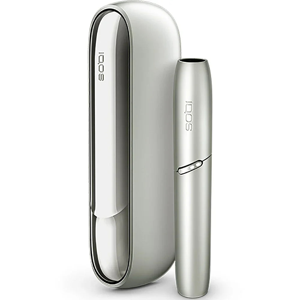 Silver IQOS device with glossy white charging case and slim holder.