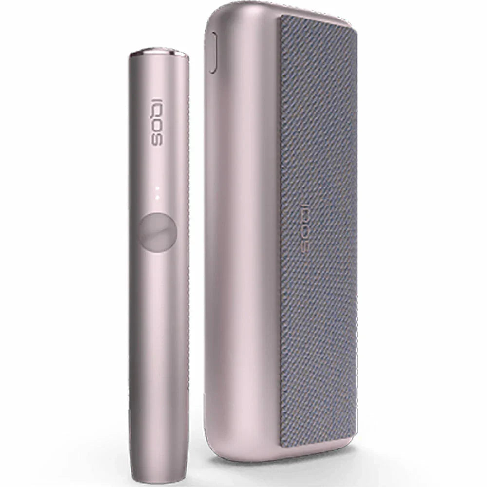 Soft pink IQOS ILUMA device with matching case and grey fabric panel.