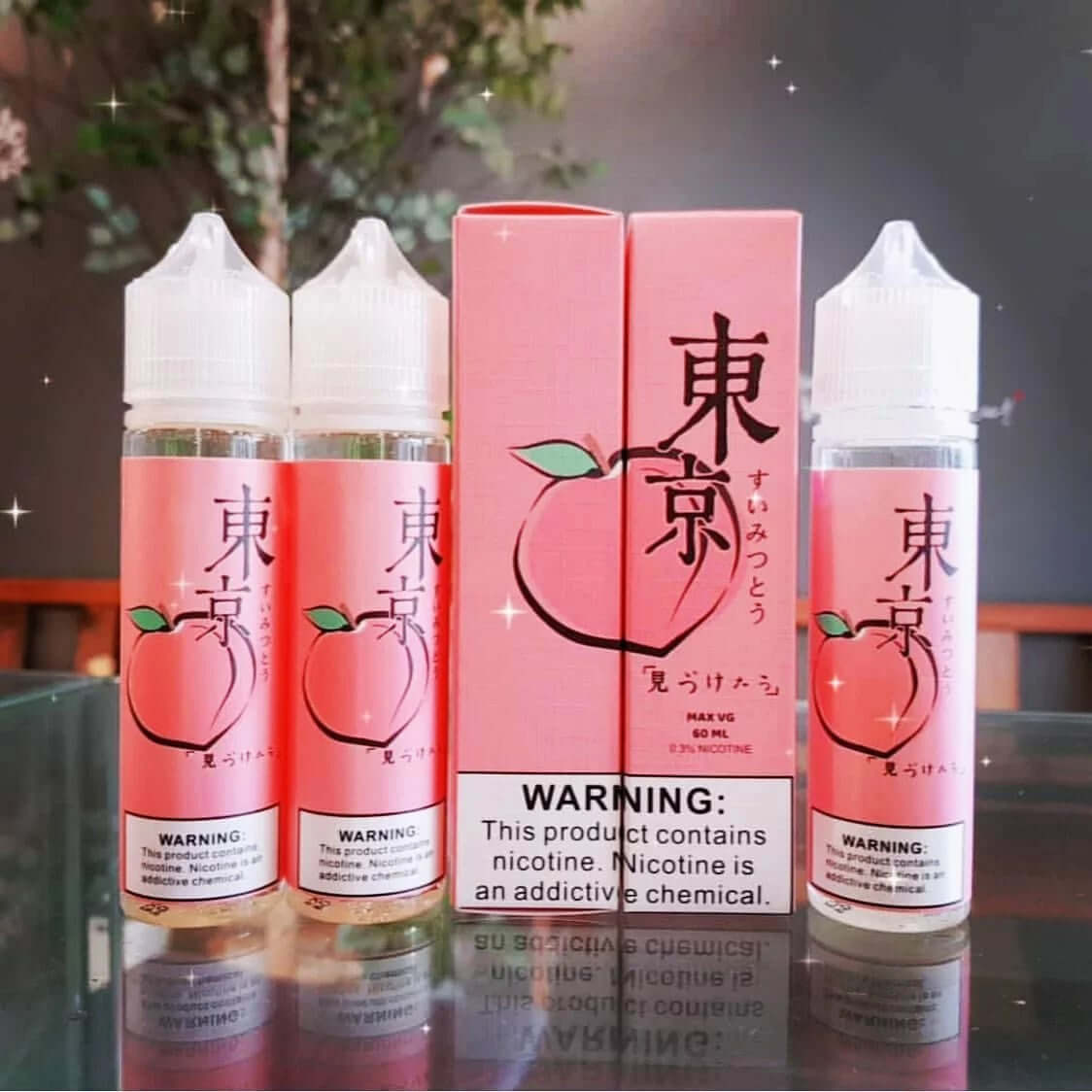 Tokyo peach e-liquid bottles with matching box, nicotine warning label